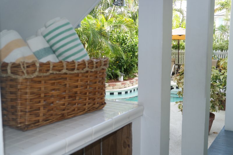 Bubbling hot tub surrounded by tropical garden at Heron House Court