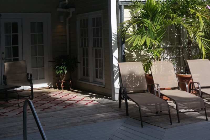 Pool area surrounded by tropical landscaping