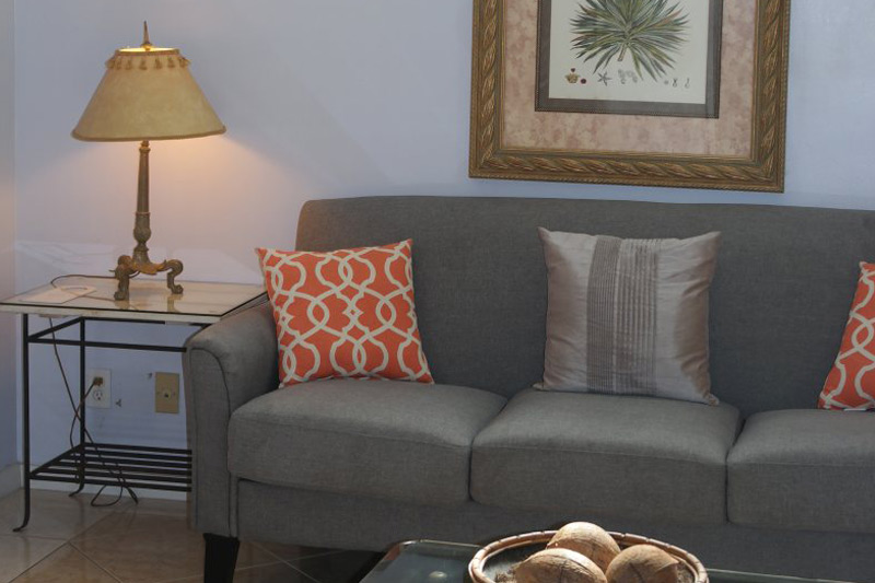 Suite sitting room with gold lamp and botanical art